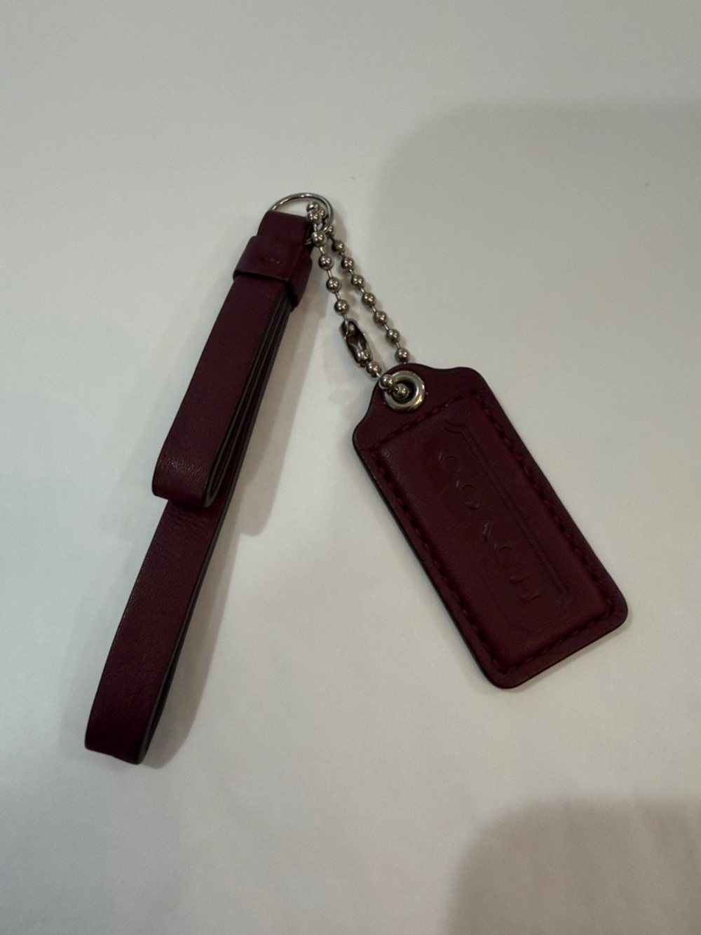 Coach Burgundy Leather hang tag/wristlet Keychain with Tag
